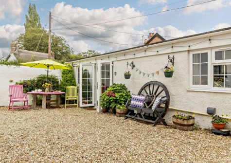 The enclosed courtyard, alfresco dining & outdoor sitting area at Little Beau, Ottery St Mary