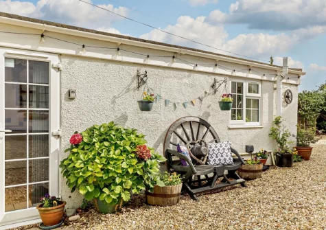 The enclosed courtyard & outdoor sitting area at Little Beau, Ottery St Mary