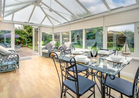 The conservatory dining & sitting area at Little Birds, St Merryn