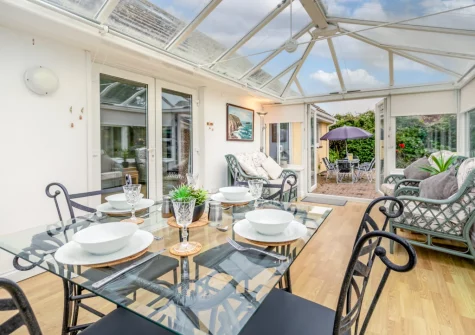 The conservatory dining & sitting area at Little Birds, St Merryn