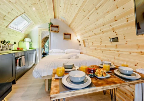 The dining area, kitchen & king-size bed at Little Cedar at Meldon Lodge Park, Meldon