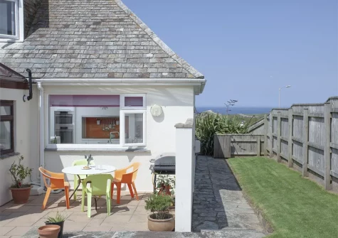 The patio, alfresco dining & barbecue area at Little Close, Lusty Glaze, Newquay