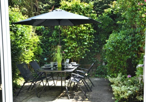 The enclosed patio garden & alfresco dining area at Little Dolphins, Padstow