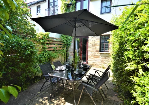 The enclosed patio garden & alfresco dining area at Little Dolphins, Padstow