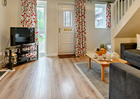 Little Egret, Padstow is a welcoming mid-terrace cottage in a peaceful spot combining countryside tranquility with town convenience, featuring a sunny enclosed terrace backing onto fields, modern comforts, and the harbor just 600 metres downhill.