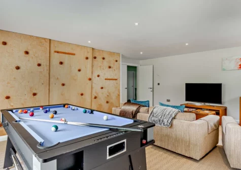 The games room with climbing wall at Little Egret View, Newquay