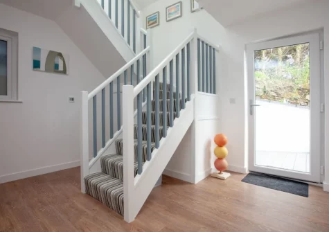 The entrance hallway & stairs up to the first floor at Little Foxes, Perranporth