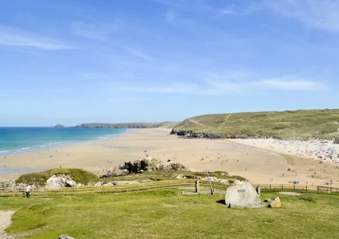 Perranporth Beach is a vast sandy 3-kilometre expanse renowned for its dramatic Atlantic swell, massive dunes & town-centre access