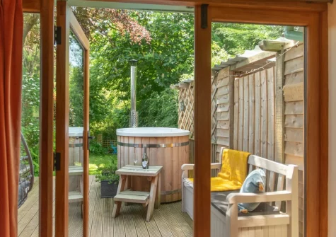 Step out on to the decked patio with wood-fired Japanese hot tub