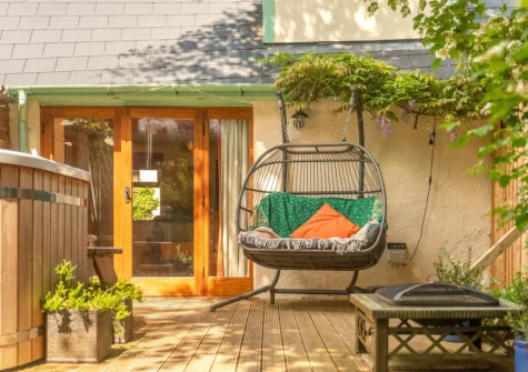 The decked  patio, outdoor sitting area & wood-fired Japanese hot tub at Little Merryfield, Guineaford