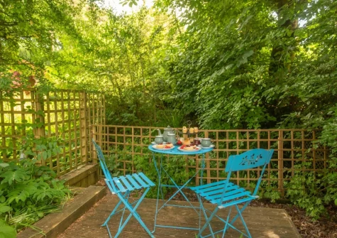 The garden, decked  area, barbecue & alfresco dining area at Little Merryfield, Guineaford