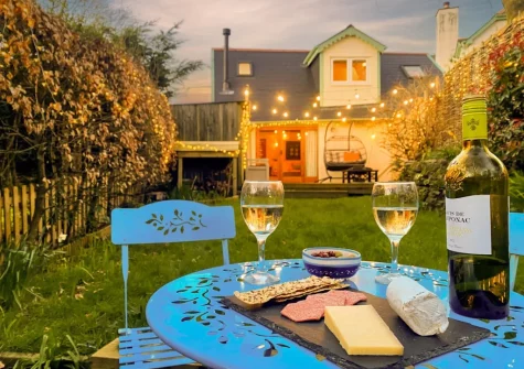 The garden, decked  area, barbecue & alfresco dining area at Little Merryfield, Guineaford