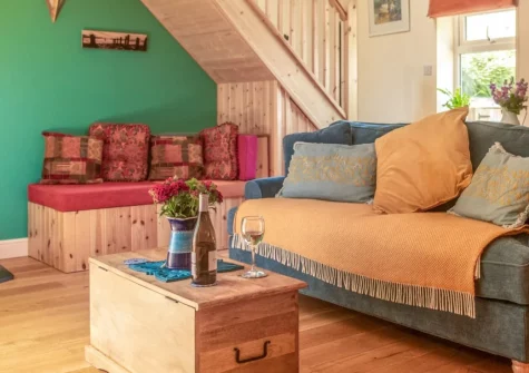 Little Merryfield, Guineaford is a romantic one-bedroom cottage with a wood-fired hot tub, enchanting stream garden, and fire-pit. Ideal for couples and small families, it's perfectly placed for North Devon's spectacular beaches and countryside.