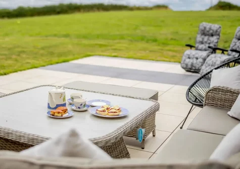 The patio, outdoor sitting area & rear garden at Little Owls Barn, Tideford Cross