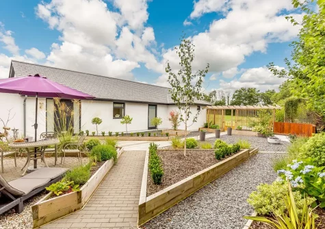 The outdoor sitting area & front garden at Little Owls Barn, Tideford Cross