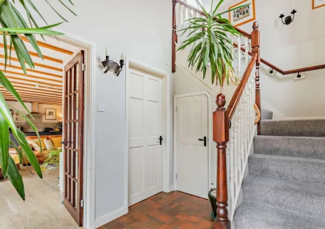 The stairs up to the first-floor landing, bedroom & en-suite shower room at Little Pear Tree Barn, Kingston