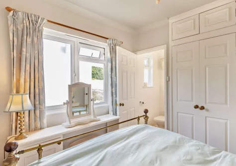 Bedroom #1 & en-suite shower room at Little Pebble, Porthallow