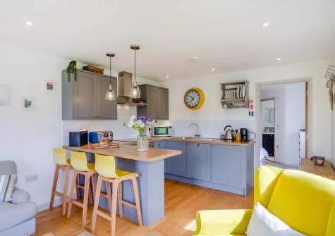 The kitchen with breakfast bar dining area at Little Seaward, Boscastle