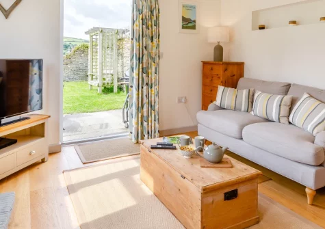 Little Seaward, Boscastle is a charming one-bedroom cottage on a working National Trust farm, just a mile from the village, with sea-view gardens, cosy contemporary interiors, and easy access to Tintagel Castle and Cornwall's dramatic coastline.