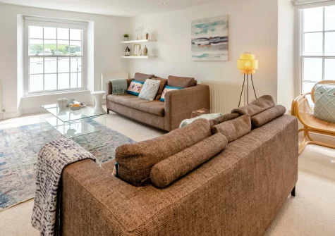 Lobster's Loft, Appledore is a bright top-floor apartment in the heart of this historic harbour town, featuring fine estuary views from large windows, spacious open-plan living, and two en-suite bedrooms, perfectly placed for North Devon adventures.