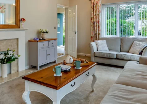 Long Beach, Westward Ho! is a spacious four-bedroom family house just half a mile from golden sands. Enjoy an enclosed garden, games room entertainment, and easy access to North Devon's beaches and attractions for memorable seaside holidays.