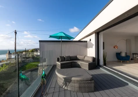 Enjoy far-reaching sea views & magnificent coastal panoramas from the decked balcony & outdoor sitting area at Longitude 5° W, Porthleven