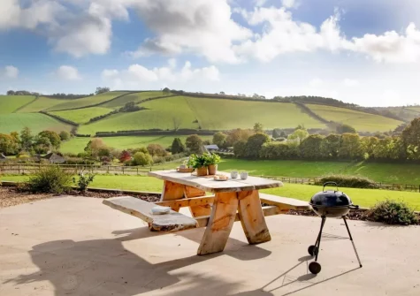 The patio, barbecue & alfresco dining area at Longpark Linhay, Compton