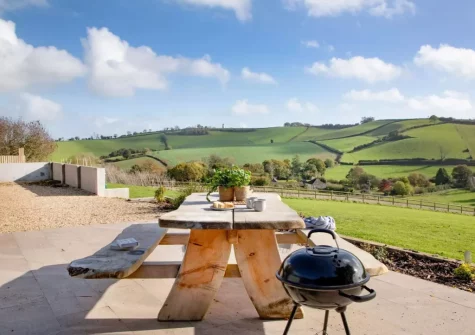 The patio, barbecue & alfresco dining area at Longpark Linhay, Compton