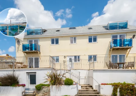 Loveday is a first-floor apartment with balcony & panoramic sea views