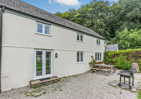 The patio, barbecue & alfresco dining area at Loveny Cottage, Two Waters Foot