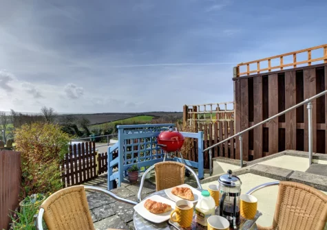The small patio, barbecue & alfresco dining area at Lowen Cottage, Padstow