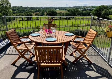The balcony & alfresco dining area at Lower Chasty Barn, Holsworthy