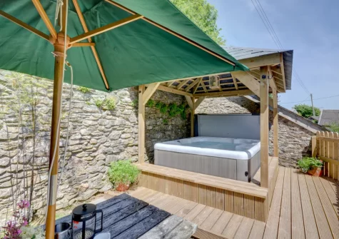 The enclosed patio, alfresco dining area & hot tub at Lower Dean Farm, Parracombe