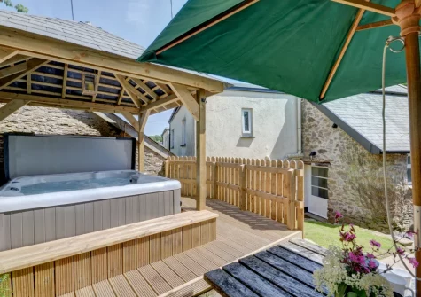 The enclosed patio, alfresco dining area & hot tub at Lower Dean Farm, Parracombe
