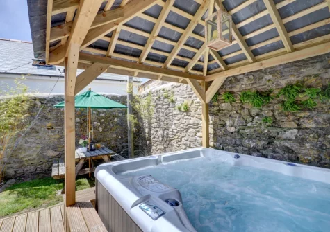 The enclosed patio, alfresco dining area & hot tub at Lower Dean Farm, Parracombe
