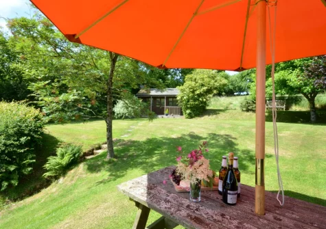 The elevated lawn garden & alfresco dining area at Lower Dean Farm, Parracombe