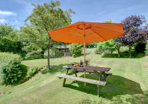 The elevated lawn garden & alfresco dining area at Lower Dean Farm, Parracombe