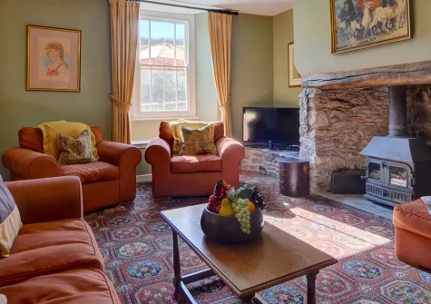 Lower Dean Farm, Parracombe is a charming stone farmhouse in an Exmoor valley with a hot tub, games barn, and adjacent horse riding stables. Perfect for families seeking countryside adventures with coastal access and traditional charm.