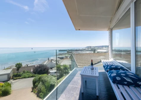 The south-facing, wrap-around balcony enjoys views across the expanse of Mount's Bay at Lower Trenarthan, Penzance