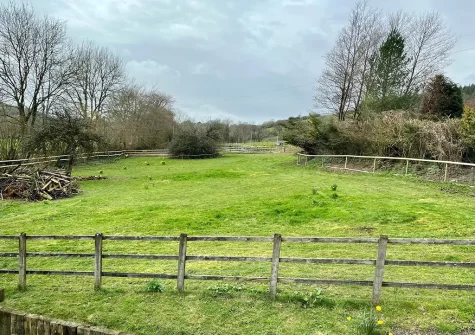 The fully enclosed dog exercise field at Lower Yeoland Barn, Swimbridge