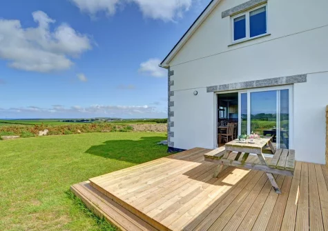 The decked patio, alfresco dining area & large enclosed lawned garden at Lucerne, Treburrick