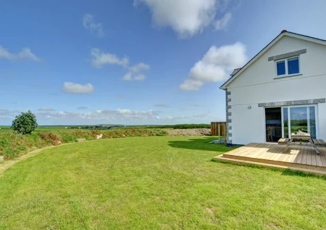 The decked patio, alfresco dining area & large enclosed lawned garden at Lucerne, Treburrick
