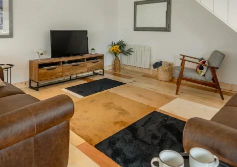 Lukes Barn, Mawla is a beautifully renovated three-bedroom cottage in peaceful countryside near Porthtowan, featuring stylish interiors, hot tub, games room, enclosed gardens, and the Coast to Coast trail just 200 metres from your door.