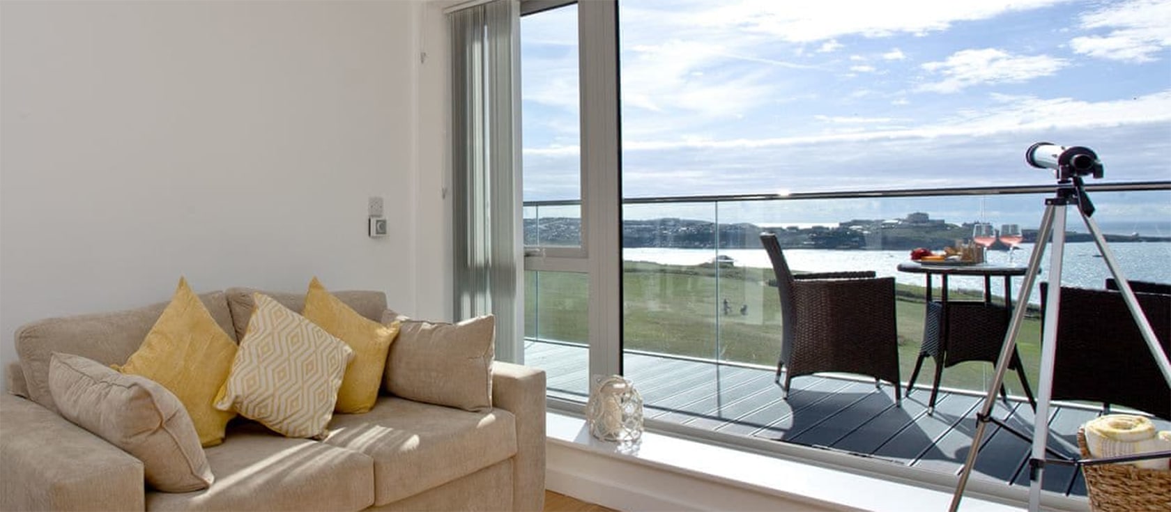 Lusty Beach View, Newquay is a modern apartment with one bedroom plus sofa bed to sleep four. Two furnished balconies provide breathtaking views of Lusty Glaze Beach nearby. Modern high-end kitchen, contemporary furnishings, garage & surfboard store.