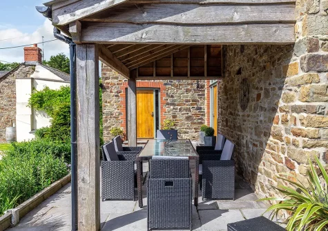 The patio & alfresco dining area at Lympscott Barn, Bradworthy
