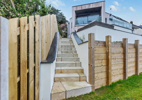 Stairs lead down to the lawned garden at Lyndhurst, Woolacombe