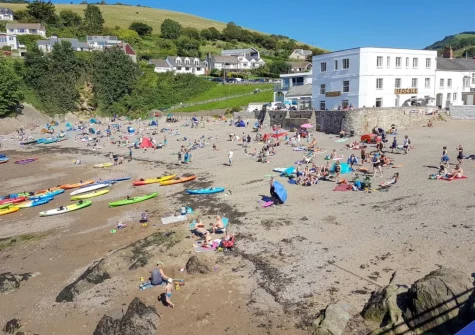 Combe Martin Beach is a picturesque sheltered cove, famous for its dramatic cliffs, excellent rock pooling & calm waters