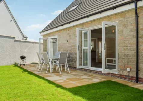 The patio, barbecue, alfresco dining area & enclosed garden at Magnolia Cottage, Appledore