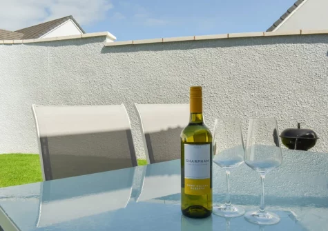The patio, barbecue, alfresco dining area & enclosed garden at Magnolia Cottage, Appledore