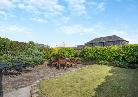 The patio, alfresco dining area & garden at Mallard Cottage, Tregolds